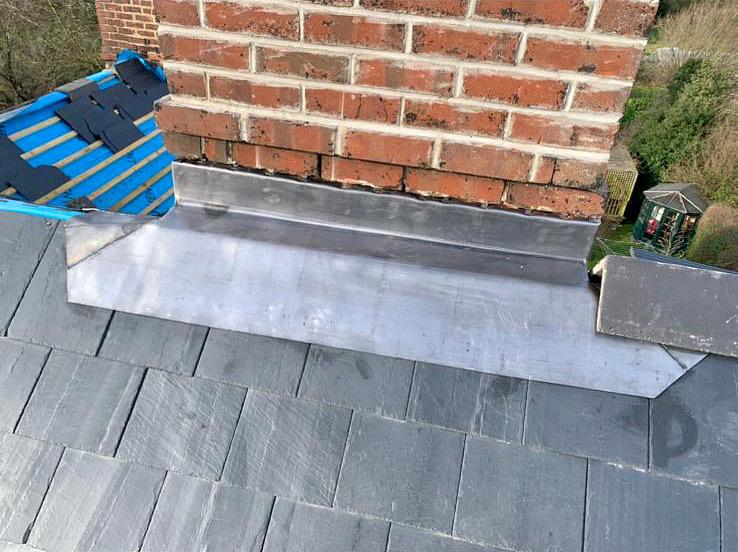 Leadwork around brick chimney by Alliance Roofing London